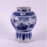 AN OCTAGONAL DUTCH DELFT BLUE AND WHITE CHINOISERIE VASE