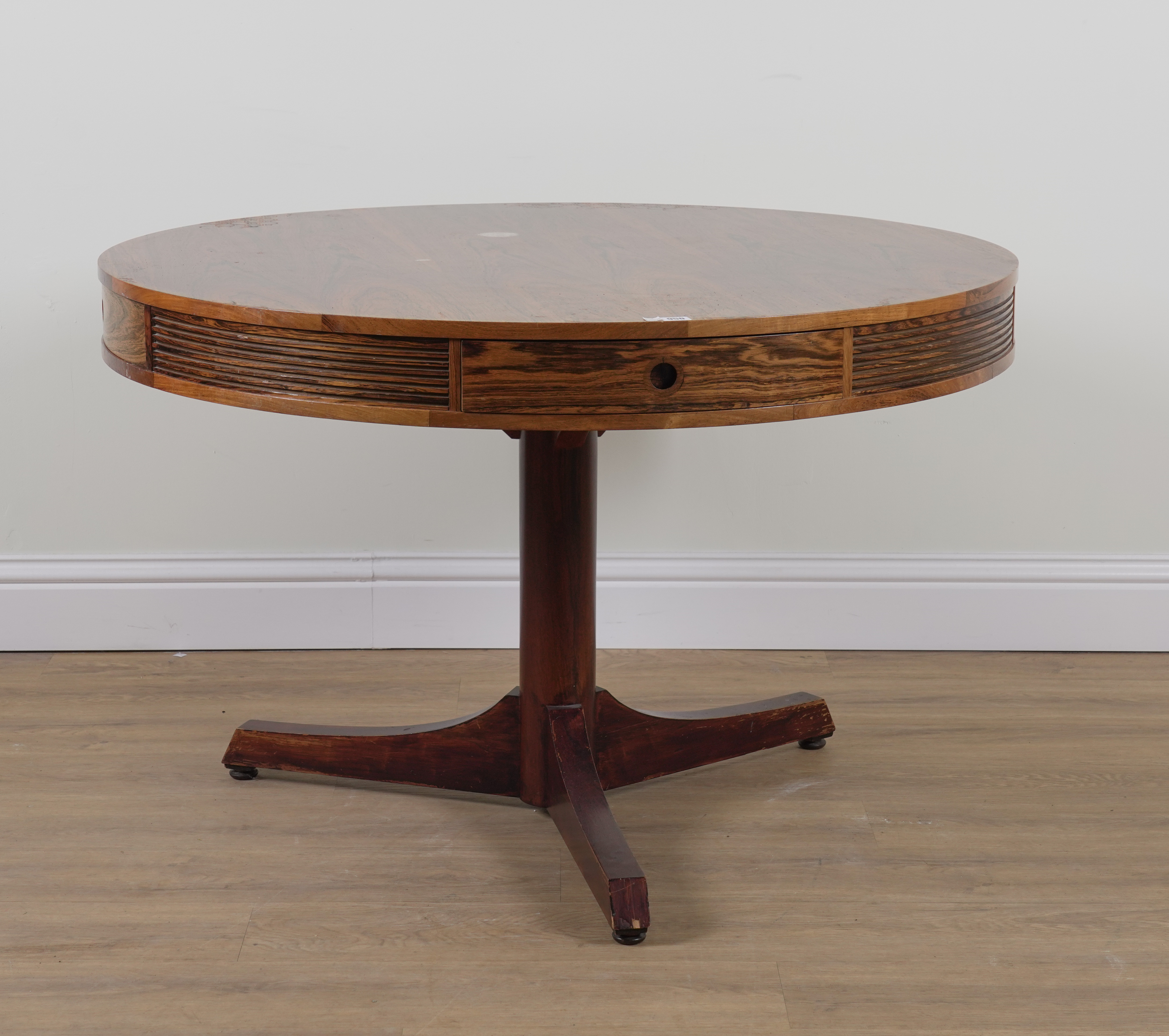 PROBABLY ARCHIE SHINE FOR HEALS FURNITURE; A MID-20TH CENTURY ROSEWOOD CIRCULAR DINING TABLE - Image 9 of 11