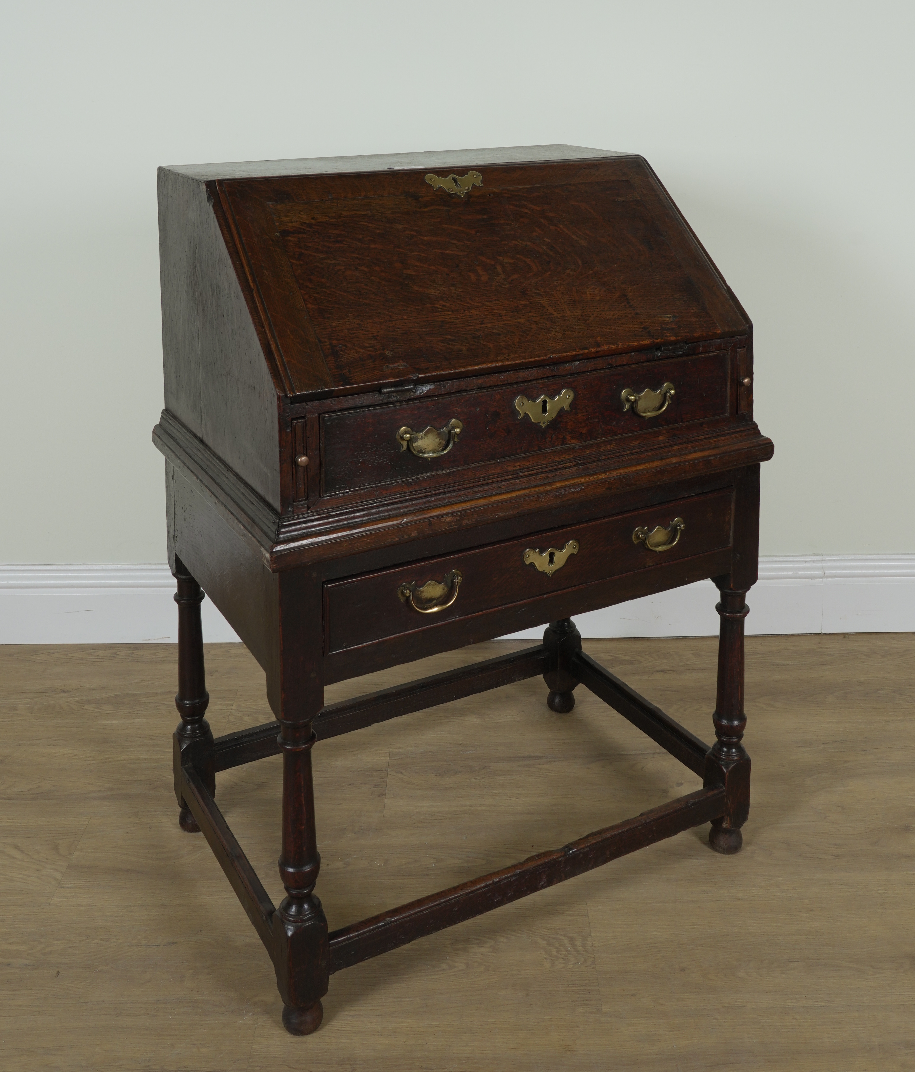 AN 18TH CENTURY OAK BUREAU ON STAND