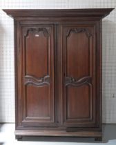 A 19TH CENTURY FRENCH STAINED OAK ARMOIRE
