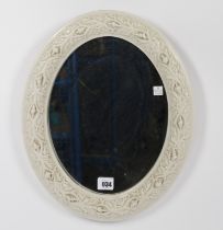 A BELLEEK PORCELAIN OVAL MIRROR