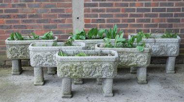A SET OF SIX RECONSTITUTED STONE GARDEN TROUGHS (6)