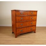 A GEORGE III LATER POLLARD OAK VENEERED FIVE DRAWER CHEST