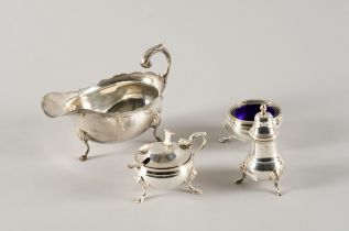 A SILVER SAUCEBOAT AND A CONDIMENT SET (5)