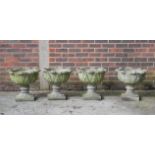 A SET OF FOUR RECONSTITUTED STONE ACANTHUS MOULDED GARDEN URNS (4)