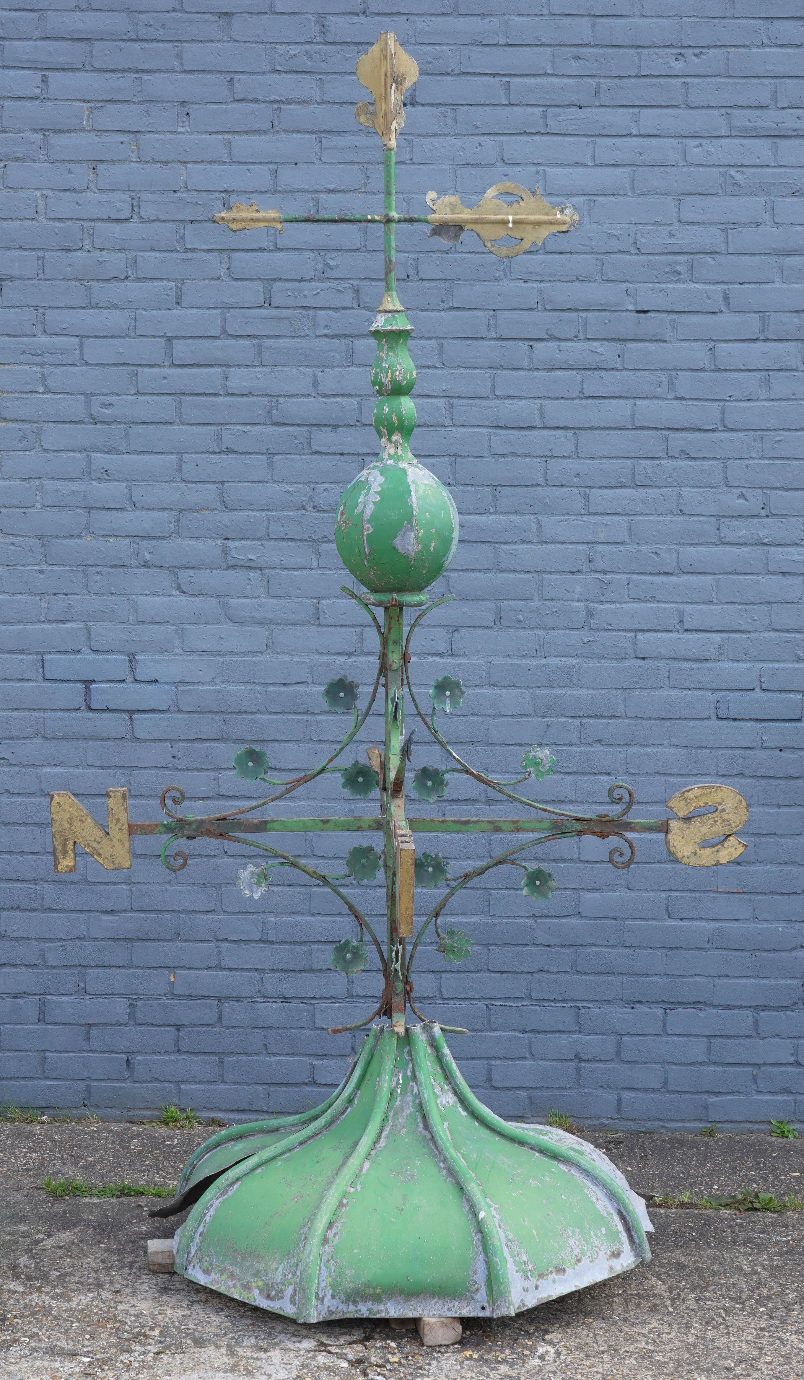 AN EARLY 20TH CENTURY POLYCHROME PAINTED WROUGHT AND CAST IRON WEATHER VANE