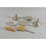A SILVER MOUNTED SEVEN PIECE DRESSING SET
