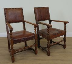 A PAIR OF CHARLES II STYLE OAK OPEN ARMCHAIRS (2)