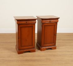 A PAIR OF STAINED BEECH SINGLE DRAWER BEDSIDE CUPBOARDS (2)