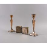A PAIR OF SILVER CANDLESTICKS, A CIGARETTE CASE AND A LADY'S COMPACT (4)