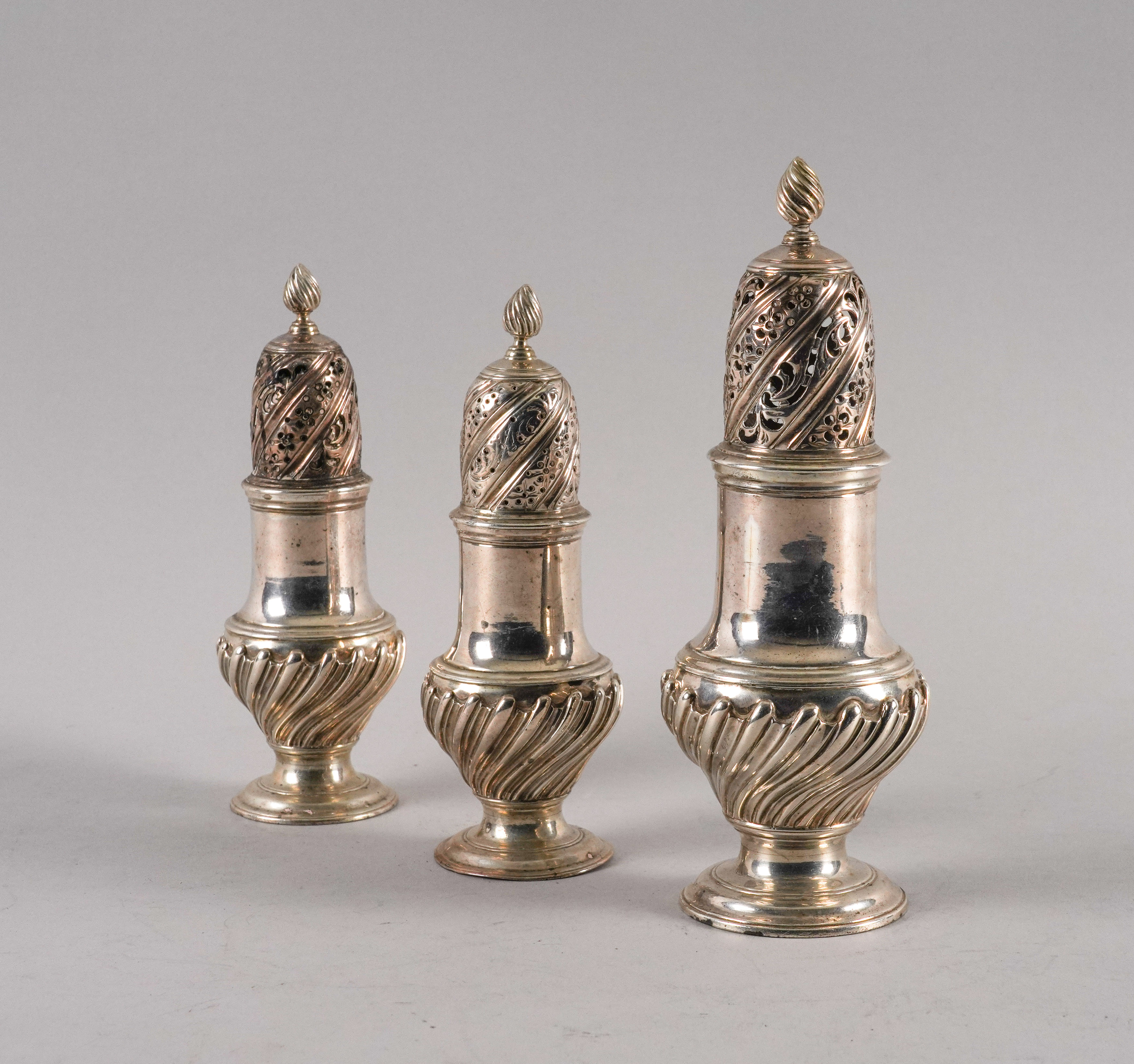 A SET OF THREE LATE GEORGE II SILVER CASTERS (3) - Image 4 of 5