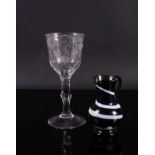 A TALL ENGRAVED FACET STEMMED GOBLET (2)