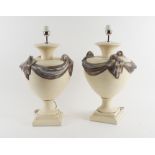 A PAIR OF CREAM DECORATED METAL SWAGGED URN TABLE LAMPS (2)