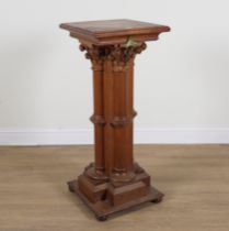 A 19TH CENTURY GOTHIC REVIVAL OAK JARDINIERE STAND