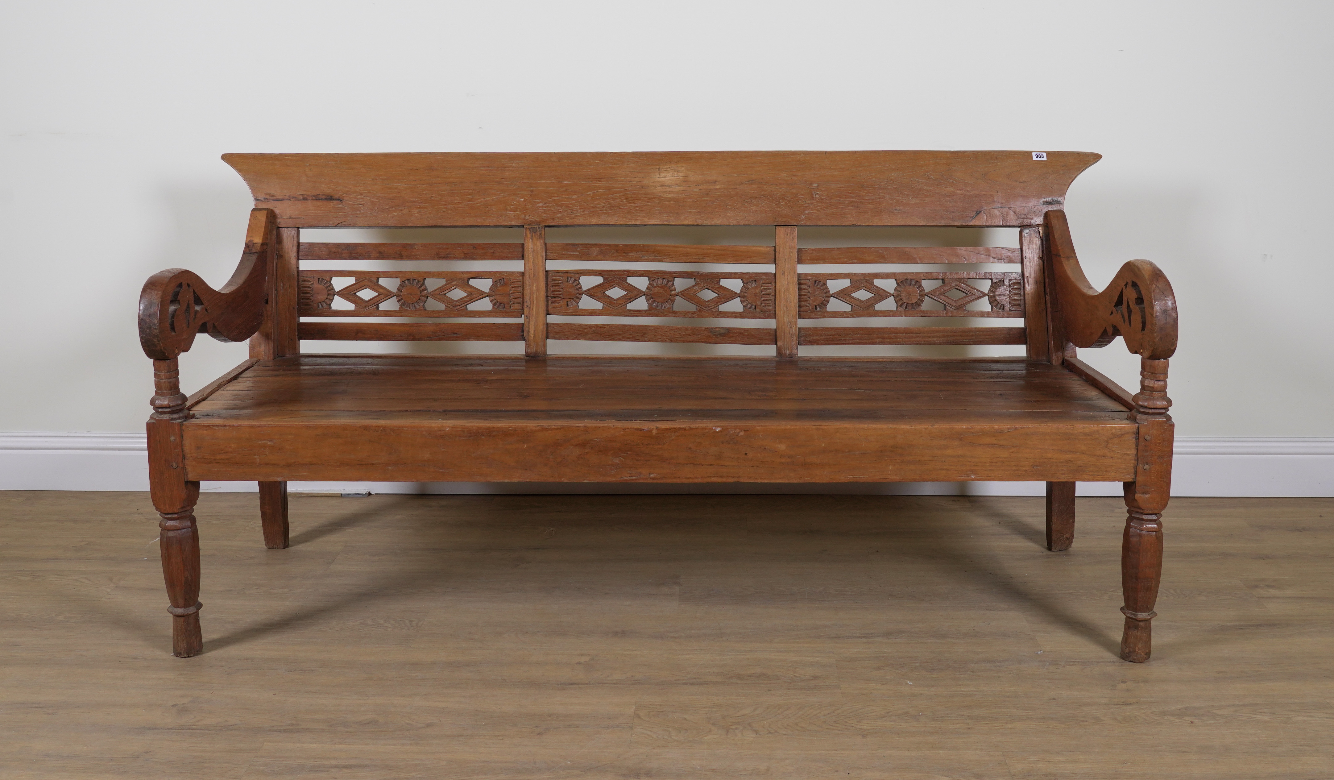 A 19TH CENTURY INDIAN TEAK BENCH