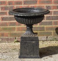 A 19TH CENTURY BLACK PAINTED CAST IRON URN