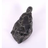 JOS HPIE: AN INUIT CANADIAN CARVED STONE FIGURE OF AN INUIT AND MASK