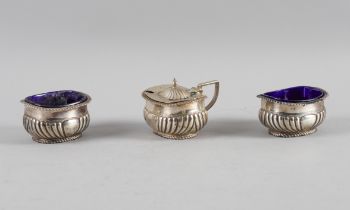 A SILVER MUSTARD POT AND A PAIR OF MATCHING SILVER SALTS (3)