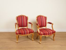 A PAIR OF LOUIS XV STYLE GILT FRAMED UPHOLSTERED ARMCHAIRS (2)