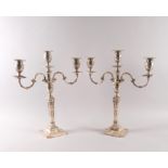 A PAIR OF SILVER THREE LIGHT TABLE CANDELABRA