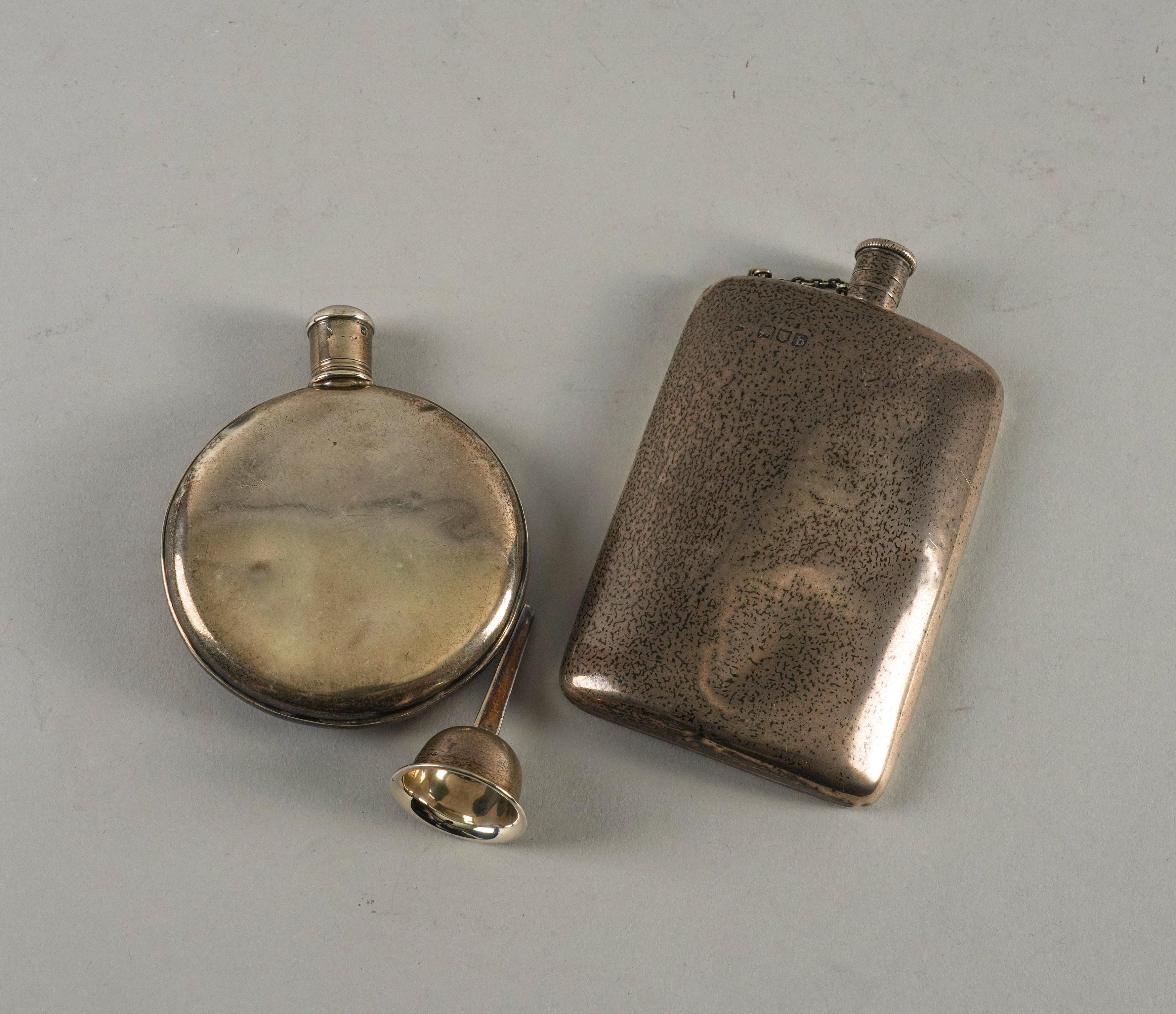 TWO SILVER FLASKS AND A SILVER FUNNEL (3)