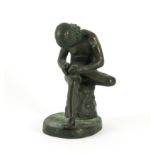 AFTER THE ANTIQUE: AN ITALIAN BRONZE MODEL OF THE SEATED SPINARIO