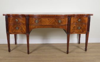 A LARGE GEORGE III MAHOGANY SERPENTINE FRONTED THREE DRAWER SIDEBOARD