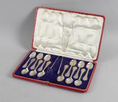 A SET OF TWELVE SILVER RAT TAIL PATTERN COFFEE SPOONS AND A PAIR OF MATCHING SUGAR TONGS (13)