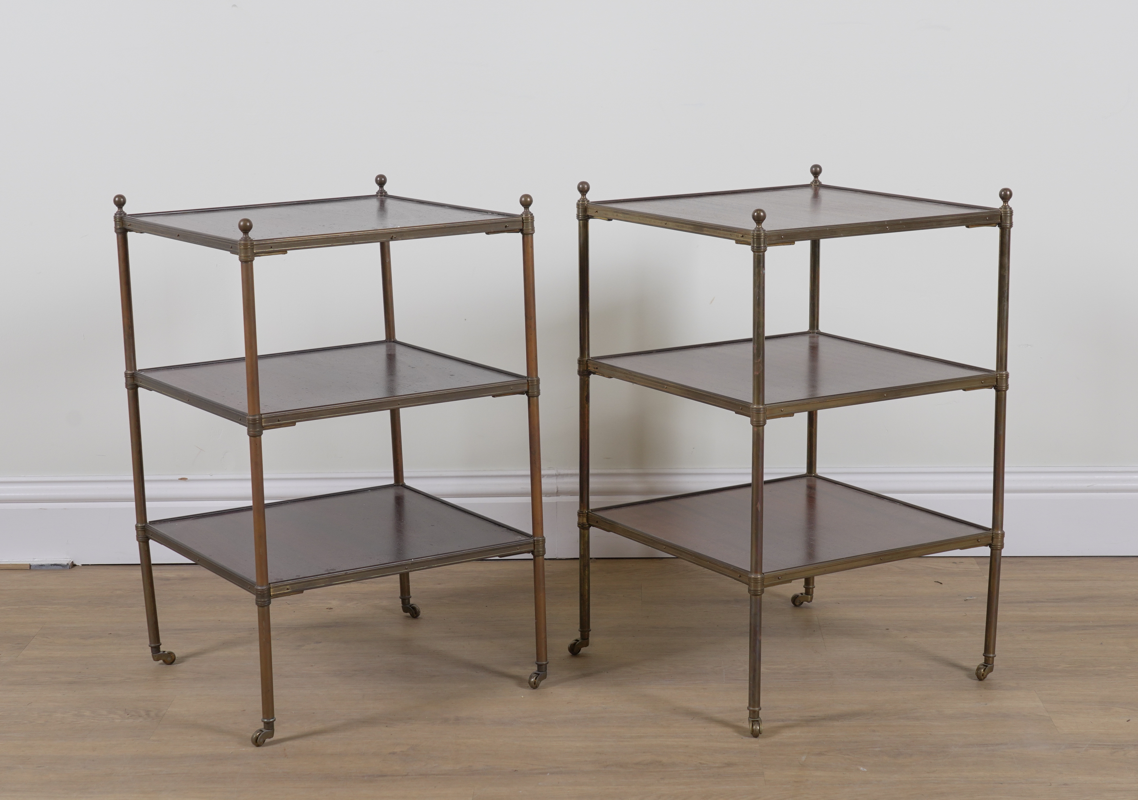 A PAIR OF MID 20TH CENTURY LACQUERED BRASS AND MAHOGANY SQUARE THREE TIER ETAGERES (2)