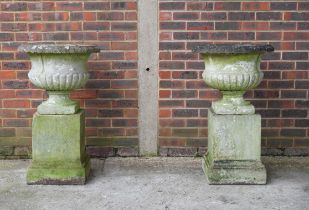A PAIR OF RECONSTITUTED STONE GARDEN URNS (2)