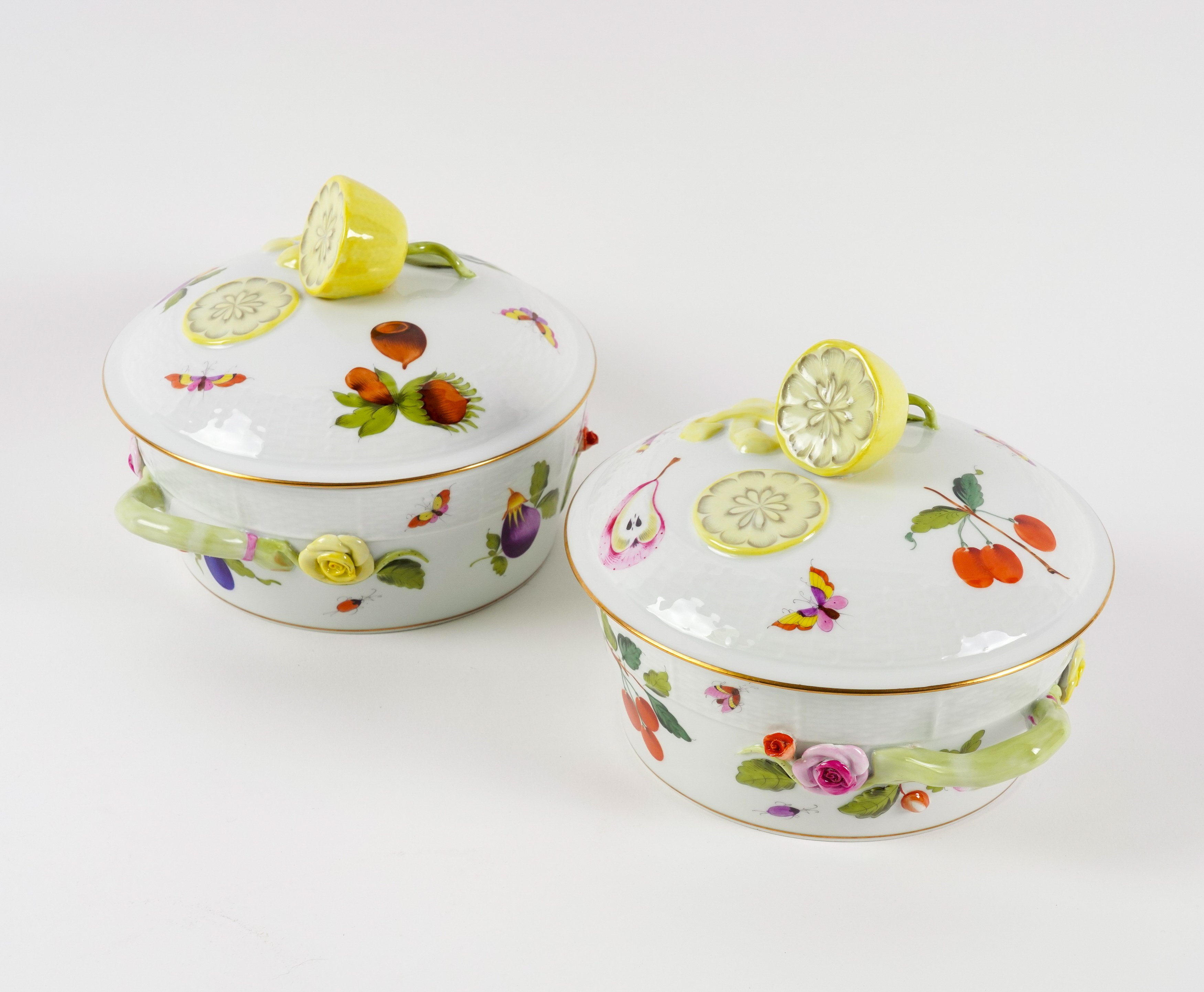 A PAIR OF HEREND `MARKET GARDEN' PATTERN OZIER MOULDED TWO-HANDLED CIRCULAR TUREENS AND COVERS...