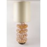 ATTRIBUTED TO CARLO NASON FOR MEZZEGA: A MURANO GLASS AMBER AND MILK GLASS TIERED TABLE LAMP