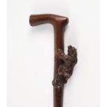 A BLACK FOREST CARVED BEAR WALKING CANE