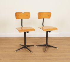 A PAIR OF MID 20TH CENTURY PLYWOOD AND METAL REVOLVING WORKSHOP CHAIRS (2)