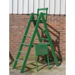 A GREEN PAINTED A-FRAME TENNIS UMPIRE CHAIR