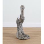 A RECONSTITUTED STONE FIGURE OF A PELICAN