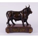 A FRENCH PATINATED BRONZE SCULPTURE OF A STANDING BULL