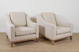 THE SOFA & CHAIR COMPANY; A PAIR OF WHITE UPHOLSTERED LOW ARMCHAIRS (2)