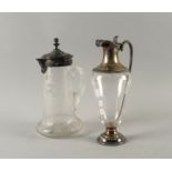 A SILVER MOUNTED GLASS CLARET JUG AND ANOTHER CLARET JUG (2)