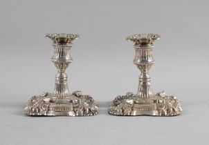 A WILLIAM IV PAIR OF SILVER CANDLESTICKS