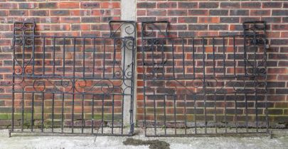 A PAIR OF BLACK PAINTED WROUGHT IRON GATES (4)