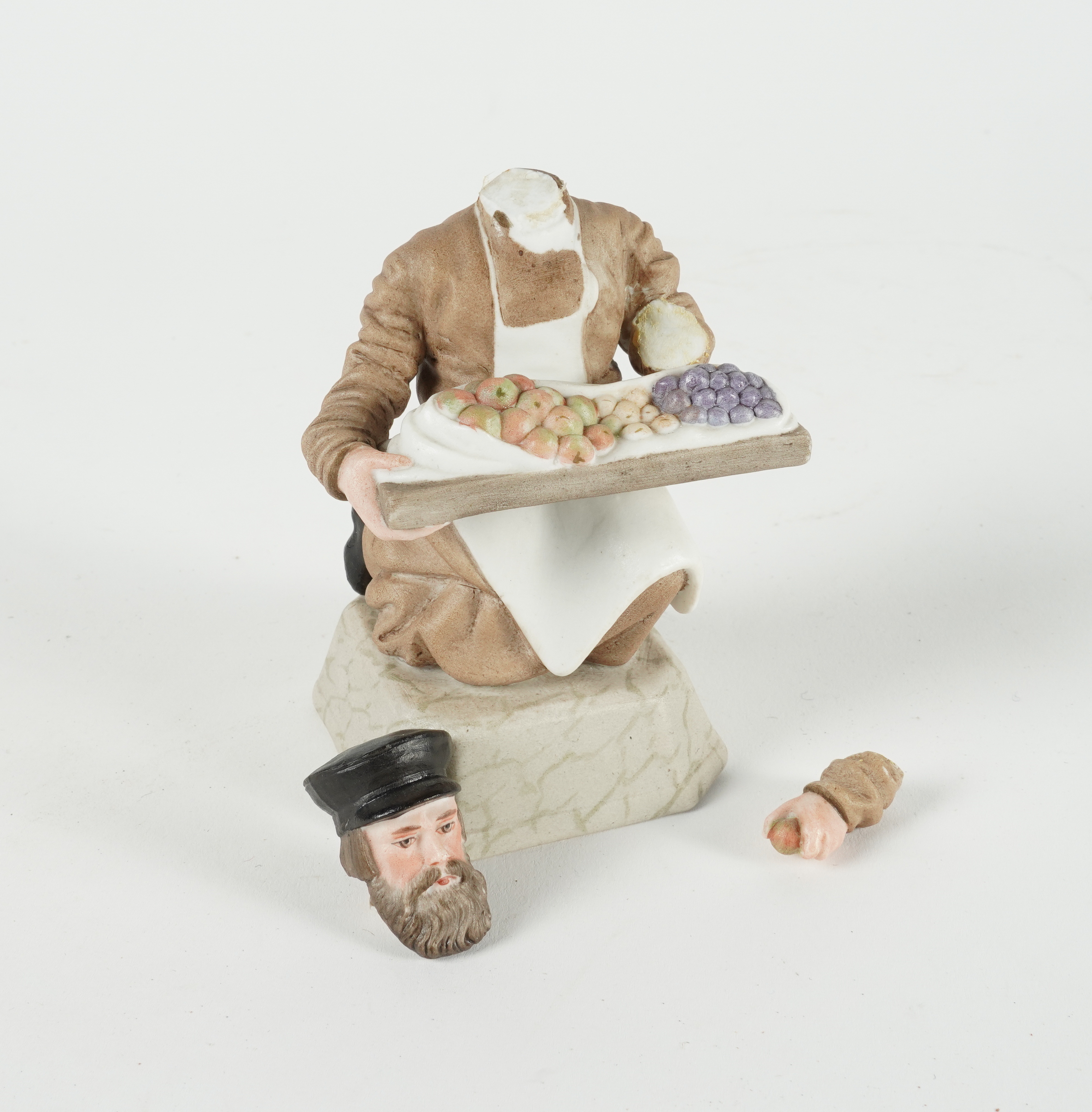 A RUSSIAN BISCUIT PORCELAIN FIGURE OF A FRUIT VENDOR - Image 3 of 3