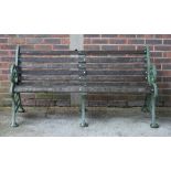 YATES HAYWOOD & CO LONDON & ROTHERHAM; A GREEN PAINTED CAST IRON SLATTED GARDEN BENCH