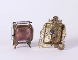 AN AUSTRIAN GILT-METAL AND ENAMEL FRAME AND A POCKET-WATCH STAND (2)