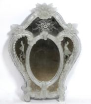 AN EARLY 20TH CENTURY VENETIAN ETCHED AND MOULDED GLASS SHAPED MIRROR