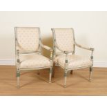 A PAIR OF LOUIS XVI STYLE POLYCHROME PAINTED OPEN ARMCHAIRS (2)
