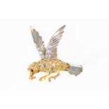 A BICOLOUR DIAMOND SET BIRD BROOCH