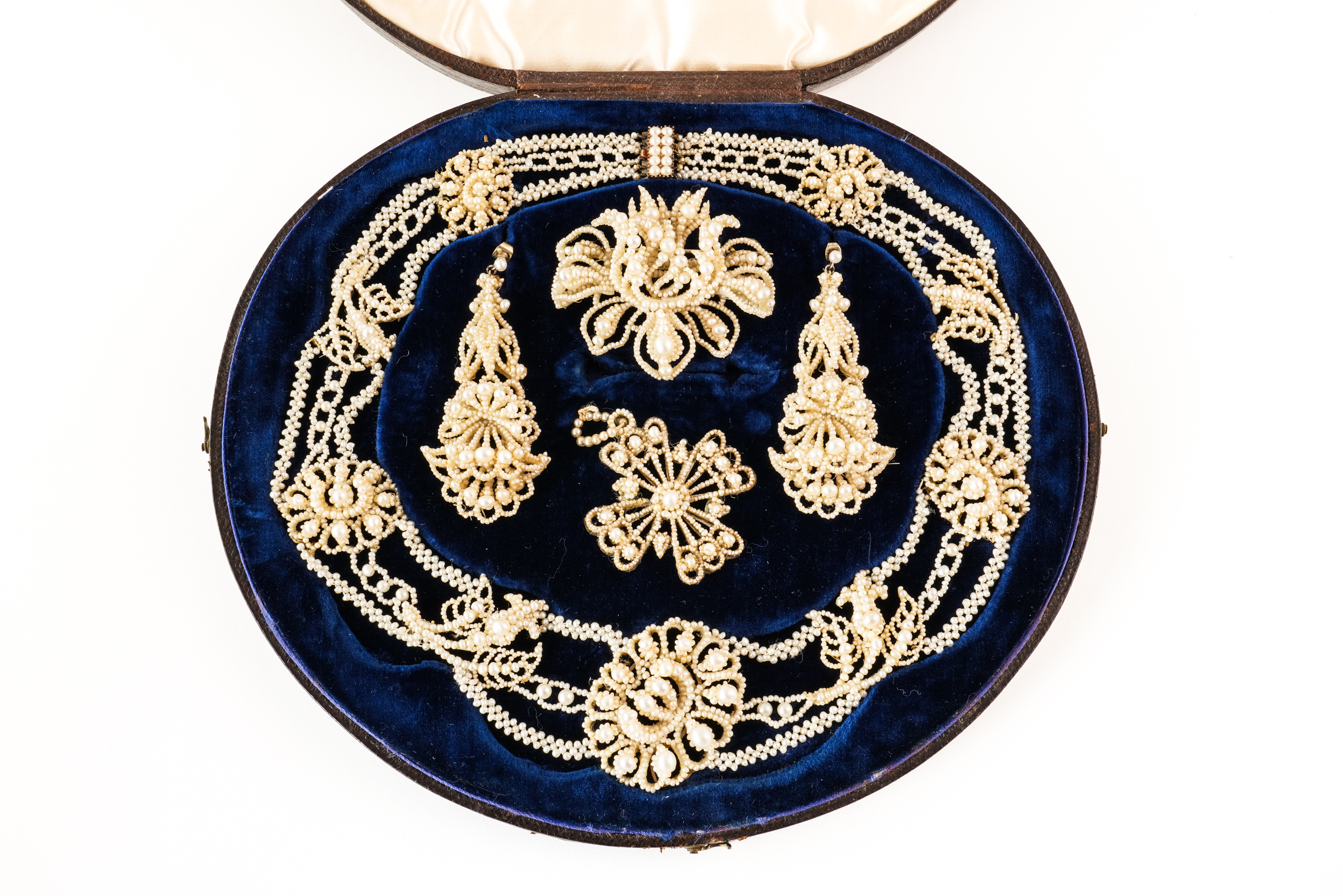 A MID 19TH CENTURY SUITE OF SEED PEARL JEWELLERY