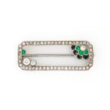 AN ART DECO DIAMOND, PASTE AND ONYX BROOCH