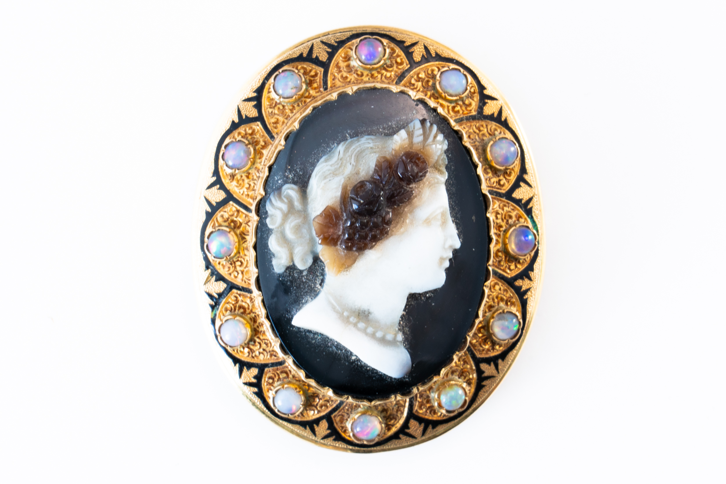 A BANDED AGATE OPAL AND ENAMELLED CAMEO BROOCH